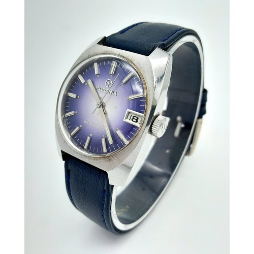 780 - A Vintage Rodania Mechanical Gents Watch. Blue leather strap. Stainless steel case - 32mm. Purple di... 