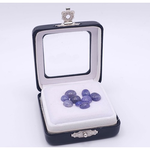 586 - A 19.6ctw Lot of Nine Blue Tanzanite Gemstones. Comes with a clip-open case.