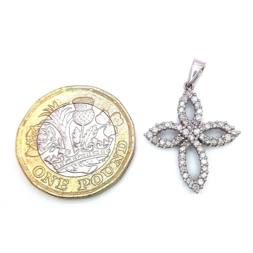 663 - An 18K White Gold Diamond Encrusted Floral Pendant. 3cm.
2.3g total weight. 0.51ctw diamonds.