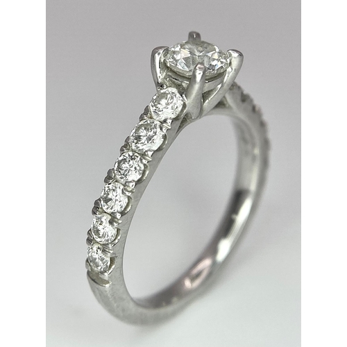 674 - The Best Story - Is The Diamond Story. A 950 platinum diamond ring with a central SI1 0.40ct brillia... 