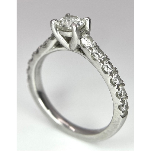 674 - The Best Story - Is The Diamond Story. A 950 platinum diamond ring with a central SI1 0.40ct brillia... 