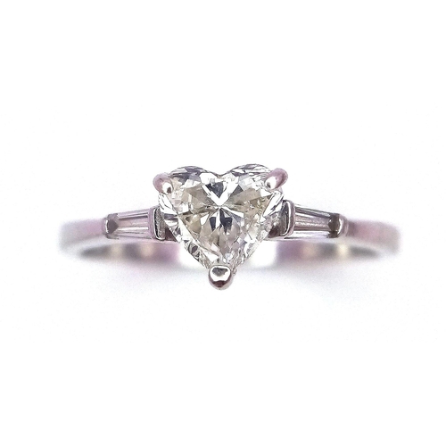 688 - An 18K White Gold and Diamond Solitaire Ring. A near white heart cut VS1 grade central diamond - 0.4... 