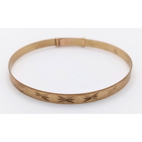 1294 - A BABIES BANGLE IN 9K GOLD FULLY ADJUSTABLE FITTING .    3gms