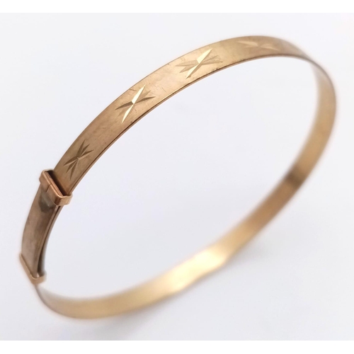 1294 - A BABIES BANGLE IN 9K GOLD FULLY ADJUSTABLE FITTING .    3gms