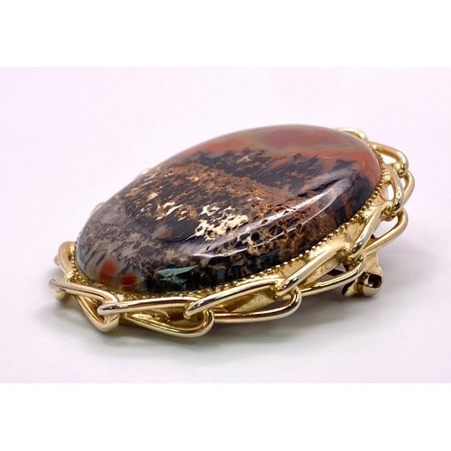 396 - Fancy Agate Stone Brooch.
Large stone framed by Gold Tone twisted metal border. Brooch measures 4cm ... 