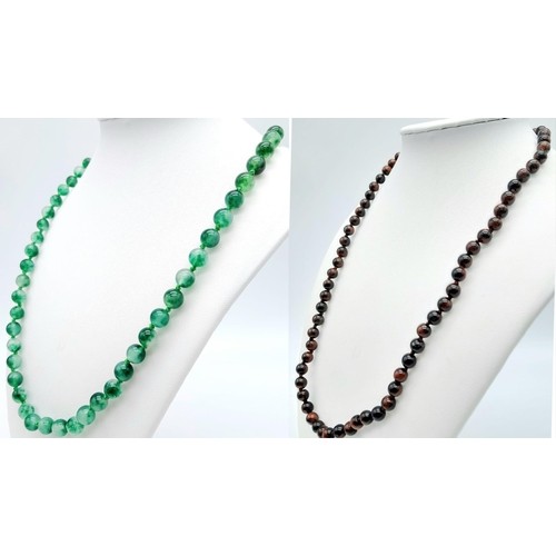 403 - Duo of Beaded Necklaces. 
One Jade Green stone and one Iridescent Black/Orange stone. Both necklaces... 