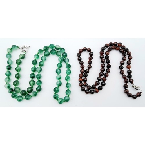 403 - Duo of Beaded Necklaces. 
One Jade Green stone and one Iridescent Black/Orange stone. Both necklaces... 