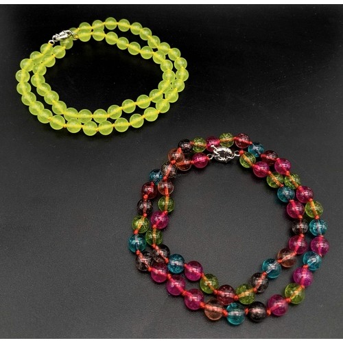 410 - Duo of Stone Beaded Necklace.
One Citrus Yellow stone and one Multi-coloured stones.
Both measure 48... 