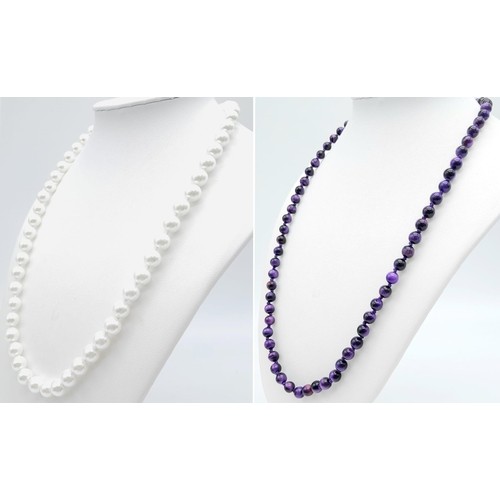 424 - Duo of Beaded Stone Necklaces.
One Pearlescent White (48cm) and one Iridescent Black/Purple Stone (5... 