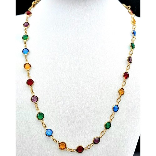 411 - A Gold Filled Jewellery Set.
Featuring a multi-coloured gem necklace (46cm) and matching drop earrin... 