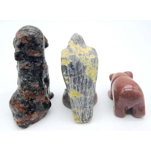 432 - A trio of Stone Carved Animals.
Featuring a Eagle, Dog and Bear. Various sizes, ranging within a fra... 