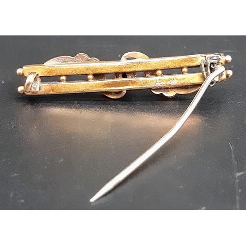 17 - An Antique 15K Rose Gold Bar Brooch. Ornate decoration. Pin has been replaced. 4.5cm length. 3g weig... 