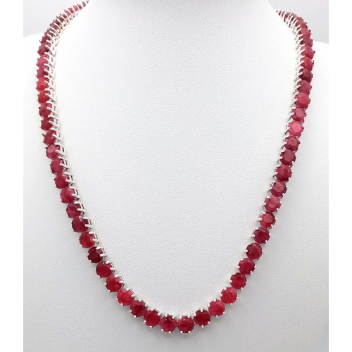 296 - A Ruby Gemstone Tennis Necklace set in 925 Silver. Round cut rubies. 45cm length. 49g total weight. ... 