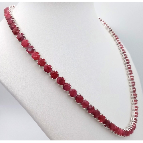 296 - A Ruby Gemstone Tennis Necklace set in 925 Silver. Round cut rubies. 45cm length. 49g total weight. ... 