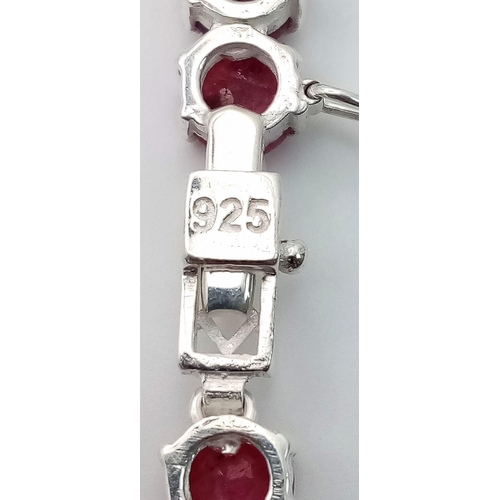 296 - A Ruby Gemstone Tennis Necklace set in 925 Silver. Round cut rubies. 45cm length. 49g total weight. ... 