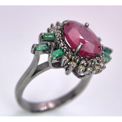 345 - A 5.80ct Ruby Ring with  0.40ctw Emeralds and 0.70ctw of Diamond Accents. Set in 925 Silver. Size M.... 