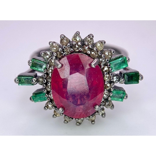 345 - A 5.80ct Ruby Ring with  0.40ctw Emeralds and 0.70ctw of Diamond Accents. Set in 925 Silver. Size M.... 