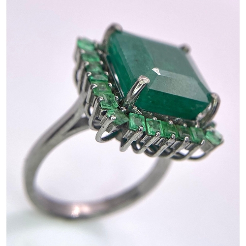 352 - A 7.80ct Emerald Ring with 0.90ctw of Emerald Accents. Set in 925 Silver. Size M. 6.46g total weight... 