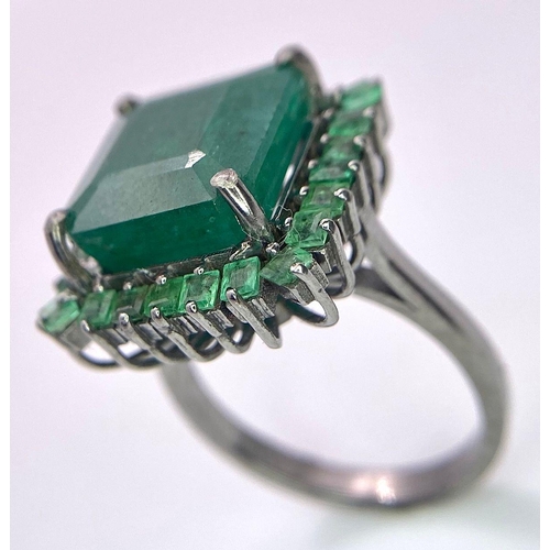 352 - A 7.80ct Emerald Ring with 0.90ctw of Emerald Accents. Set in 925 Silver. Size M. 6.46g total weight... 