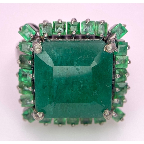 352 - A 7.80ct Emerald Ring with 0.90ctw of Emerald Accents. Set in 925 Silver. Size M. 6.46g total weight... 