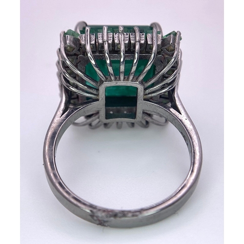 352 - A 7.80ct Emerald Ring with 0.90ctw of Emerald Accents. Set in 925 Silver. Size M. 6.46g total weight... 