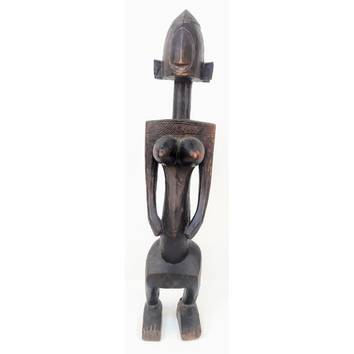 460 - An Antique African Songye Tribe Female Wooden Statue. This fertility and youth statue stands at 95cm... 