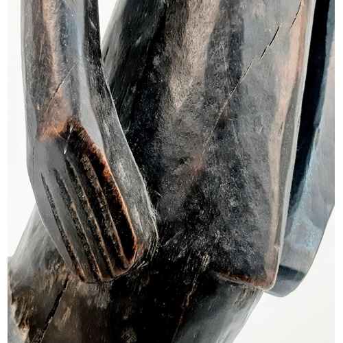 460 - An Antique African Songye Tribe Female Wooden Statue. This fertility and youth statue stands at 95cm... 