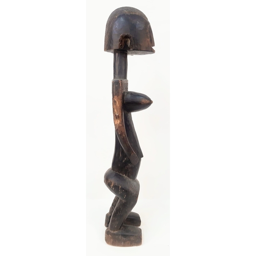 460 - An Antique African Songye Tribe Female Wooden Statue. This fertility and youth statue stands at 95cm... 