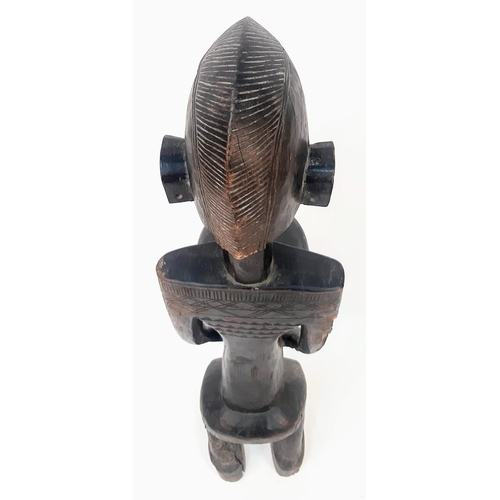 460 - An Antique African Songye Tribe Female Wooden Statue. This fertility and youth statue stands at 95cm... 