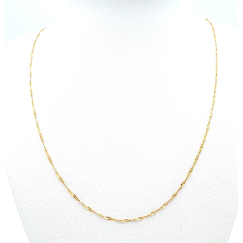 464 - An Italian 9K Yellow Gold Twisted Flat Curb Necklace. 60cm length. 2.31g weight.