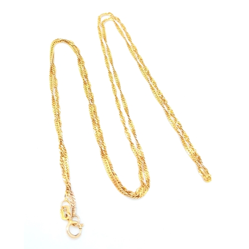 464 - An Italian 9K Yellow Gold Twisted Flat Curb Necklace. 60cm length. 2.31g weight.