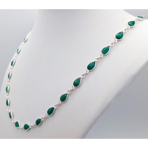 76 - A Pear Cut Emerald Gemstone Long Chain Necklace set in 925 Silver. 56cm length. 16.71g total weight.... 