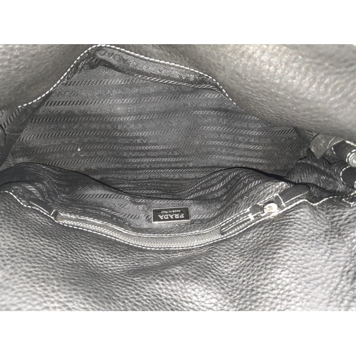 48 - A Prada Black Vitello Shoulder Bag. Leather exterior with silver-toned hardware, two straps, push lo... 