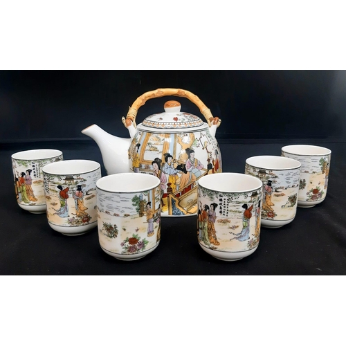 206 - A Chinese Tea Set with 6 cups.
Comprising of a Teapot with bamboo handle and six Chinese Tea Cups. E... 