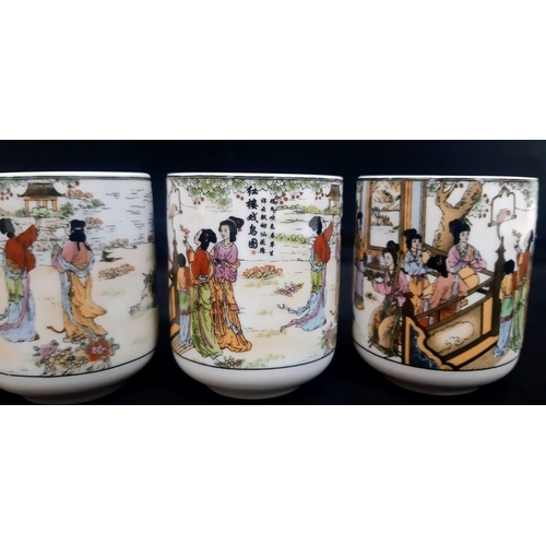 206 - A Chinese Tea Set with 6 cups.
Comprising of a Teapot with bamboo handle and six Chinese Tea Cups. E... 