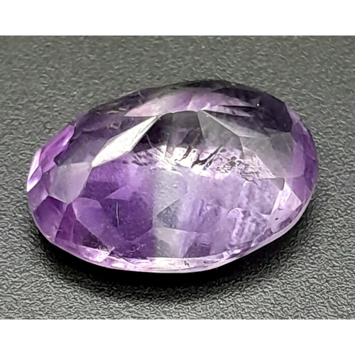 320 - A 7.44ct Amethyst Loose Gemstone in Oval shape. Brazil Origin. GFCO Swiss Certified.