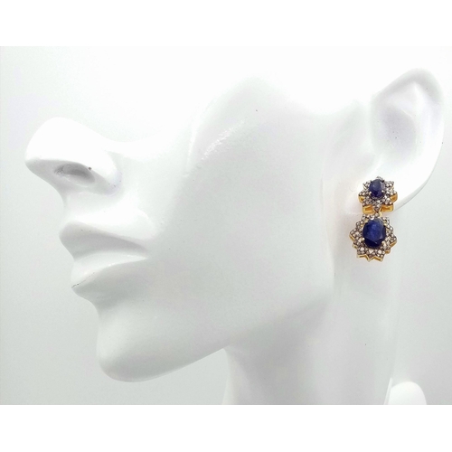 57 - A Pair of 8ctw Blue Sapphire Drop Earrings with Diamond Accents. Set in gilded 925 Silver. Diamond 1... 