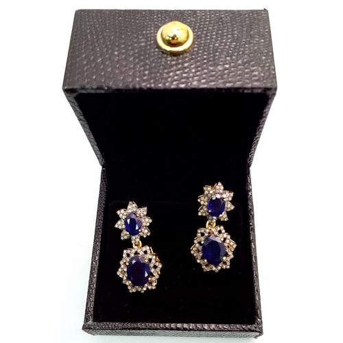 57 - A Pair of 8ctw Blue Sapphire Drop Earrings with Diamond Accents. Set in gilded 925 Silver. Diamond 1... 