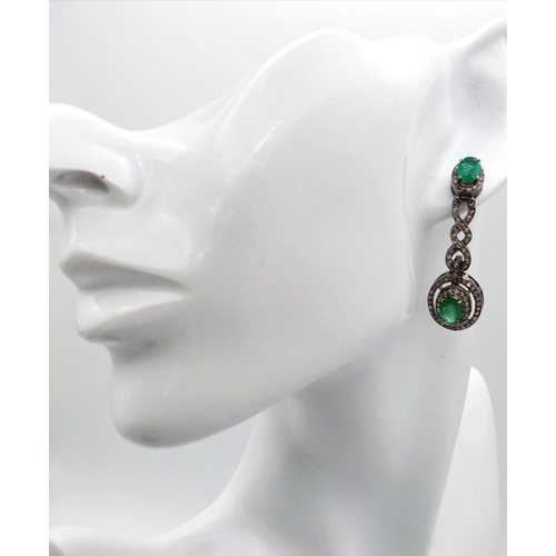 72 - A Pair of Art Deco Style 6ct Emerald and Diamond Drop Earrings. Set in 925 Silver. Diamonds - 2ctw. ... 