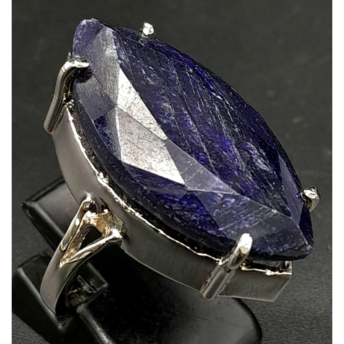 265 - A Marquise Cut Blue Sapphire 925 Silver Ring. Size M. Sapphire - 60ct.  12.70g total weight. Comes w... 