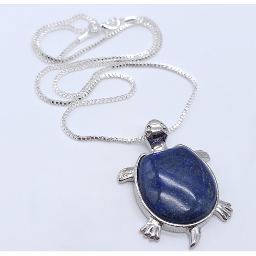 293 - A Lapis Lazuli Turtle Pendant on a White Metal Necklace. 4cm and 46cm.