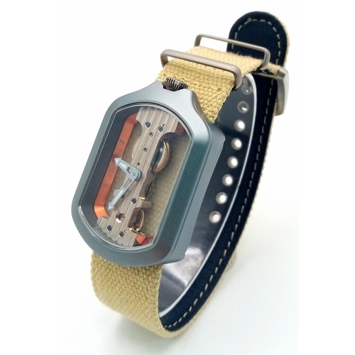 51 - A Verticale Mechanical Top Winder Unisex Watch. Beige textile strap with silver tone skeleton case. ... 