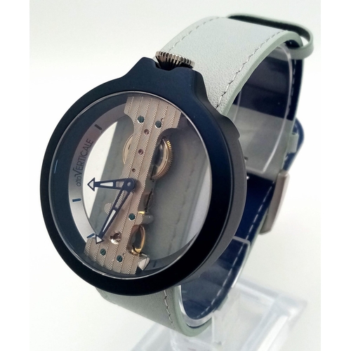 64 - A Verticale Mechanical Top Winder Unisex Watch. Turquoise strap with navy toned skeleton case. As ne... 