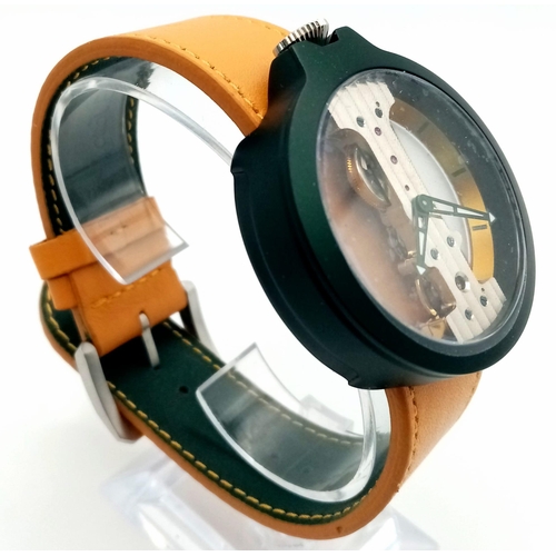 78 - A Verticale Mechanical Top Winder Unisex Watch. Orange strap, dark green tone skeleton case. As new ... 