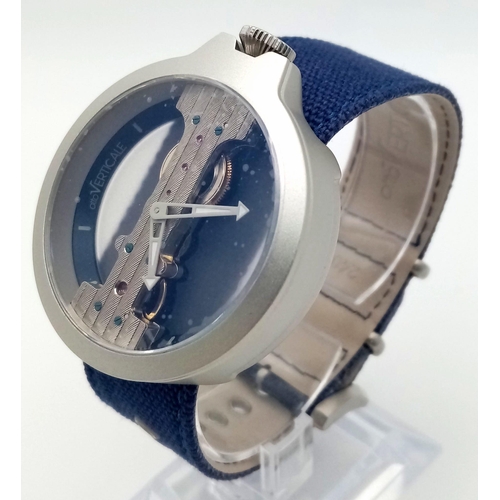 92 - A Verticale Mechanical Top Winder Unisex Watch. Navy blue strap, silver toned skeleton case. As new ... 