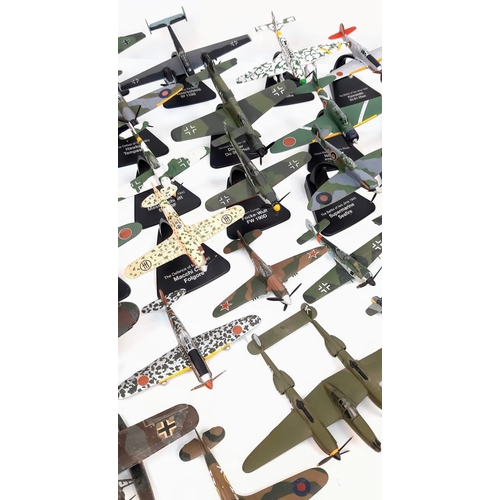 104 - A Collection of Battle of Britain Model Fighter Planes. Over thirty die-cast metal planes with stand... 