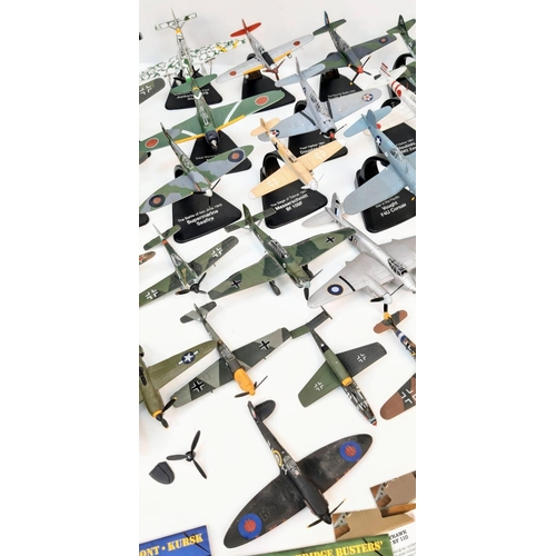 104 - A Collection of Battle of Britain Model Fighter Planes. Over thirty die-cast metal planes with stand... 