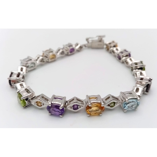 123 - A Multi Gemstones 925 Silver Tennis Bracelet - Includes:  Peridot, Citrine, Amethyst, Aquamarine and... 