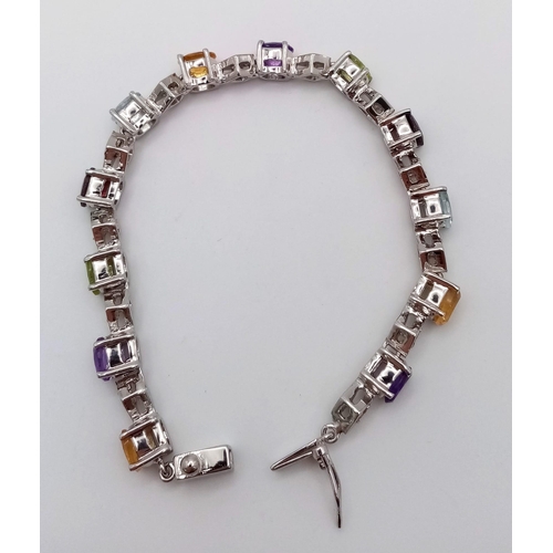 123 - A Multi Gemstones 925 Silver Tennis Bracelet - Includes:  Peridot, Citrine, Amethyst, Aquamarine and... 