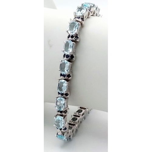 37 - An Aquamarine Gemstone Tennis Bracelet set in 925 Silver. 18cm length. 28g. Ref: HV -2177